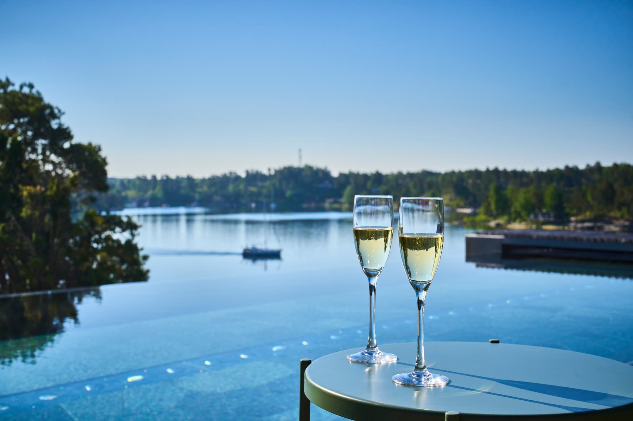Champagne flutes over the Djurönäset infinity pool