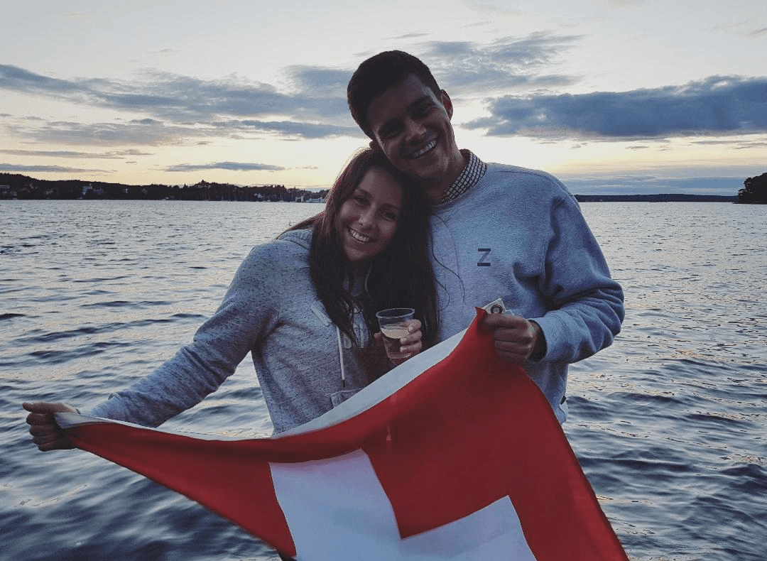 Boat at sunset with Swiss flag